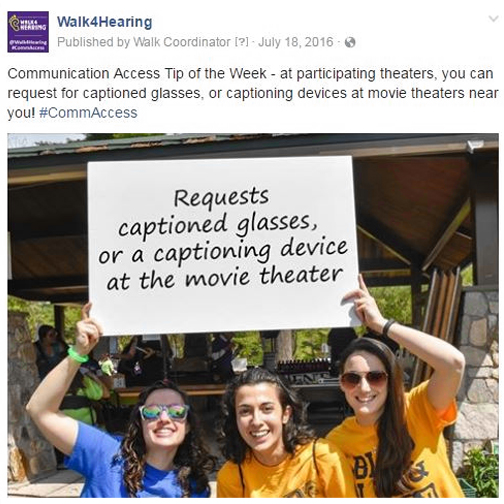 photo of young adults holding up a signe to request a captioning device at a movie theater